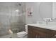 Bathroom with a glass enclosed shower and modern vanity at 1015 Jack Nicklaus Ct, Kissimmee, FL 34747