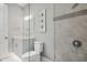 Bathroom with a glass enclosed shower and modern vanity at 1015 Jack Nicklaus Ct, Kissimmee, FL 34747