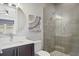 Bathroom with a glass enclosed shower and modern vanity at 1015 Jack Nicklaus Ct, Kissimmee, FL 34747