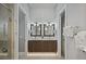 Elegant bathroom featuring a double vanity, decorative mirrors, and modern lighting at 1015 Jack Nicklaus Ct, Kissimmee, FL 34747