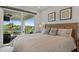 Bright bedroom with sliding glass doors to a lovely outdoor patio and a luxurious bed at 1015 Jack Nicklaus Ct, Kissimmee, FL 34747
