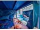 A room with a decorative castle bunk bed and blue accents at 1015 Jack Nicklaus Ct, Kissimmee, FL 34747