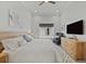Bedroom with a large bed, dresser, and a neutral color scheme at 1015 Jack Nicklaus Ct, Kissimmee, FL 34747