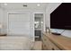 Spacious bedroom with a stylish dresser, closet, and an attached bathroom at 1015 Jack Nicklaus Ct, Kissimmee, FL 34747