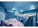 Themed bedroom with custom ice castle bunk beds and 'Frozen' character bedding at 1015 Jack Nicklaus Ct, Kissimmee, FL 34747