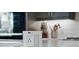 Close-up of a modern counter, showcasing built-in outlets and sleek design elements in the contemporary kitchen at 1015 Jack Nicklaus Ct, Kissimmee, FL 34747