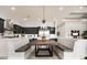 Cozy dining area with booth seating and modern lighting in kitchen at 1015 Jack Nicklaus Ct, Kissimmee, FL 34747