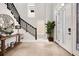 Bright foyer with tile floors, high ceilings, decorative mirror and staircase at 1015 Jack Nicklaus Ct, Kissimmee, FL 34747