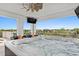 Relax on the covered balcony in this hot tub with a mounted tv and neighborhood views at 1015 Jack Nicklaus Ct, Kissimmee, FL 34747