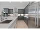 Modern kitchen with white countertops, subway tile backsplash and stainless steel appliances at 1015 Jack Nicklaus Ct, Kissimmee, FL 34747