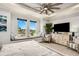 Comfortable bedroom featuring a window seat, modern furniture, and a view of the outdoor community at 1015 Jack Nicklaus Ct, Kissimmee, FL 34747