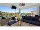 Inviting covered outdoor living space complete with comfortable seating, a pool table, and a view at 1015 Jack Nicklaus Ct, Kissimmee, FL 34747