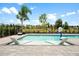 A beautiful backyard pool complete with lounge chairs and a leafy view at 1015 Jack Nicklaus Ct, Kissimmee, FL 34747