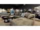 Spacious home theater features a large corduroy sofa and comfortable seating for an immersive viewing experience at 1015 Jack Nicklaus Ct, Kissimmee, FL 34747