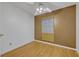 Small bedroom featuring a ceiling fan, window with blinds, and hardwood flooring at 1050 Bob White Trl, Chuluota, FL 32766