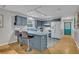 Kitchen with an island, barstool seating, and modern appliances at 1050 Bob White Trl, Chuluota, FL 32766