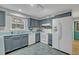 Functional kitchen with ample cabinet space, modern appliances, and tile flooring at 1050 Bob White Trl, Chuluota, FL 32766