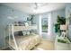 bedroom with bunk beds and playful wall art at 110 Rosedale Dr, Deltona, FL 32738