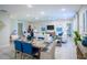 Dining area with a wooden table and blue accents at 110 Rosedale Dr, Deltona, FL 32738