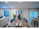 Bright dining room with a wooden table and blue chairs at 110 Rosedale Dr, Deltona, FL 32738