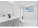 Bright bathroom featuring new floors, modern fixtures, and a new vanity at 1113 Leeward Dr, Deltona, FL 32738