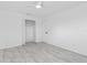 Bright bedroom featuring new floors, an updated ceiling fan, and a large closet at 1113 Leeward Dr, Deltona, FL 32738