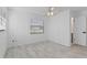 Bright bedroom featuring new floors, an updated ceiling fan, and natural light from a large window at 1113 Leeward Dr, Deltona, FL 32738