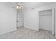 Bright bedroom featuring new floors, an updated ceiling fan, and a large closet at 1113 Leeward Dr, Deltona, FL 32738