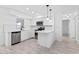 Clean kitchen with white cabinets, stainless steel appliances, tile floors, and lots of light at 1113 Leeward Dr, Deltona, FL 32738