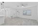 Bright room featuring tile floors, a ceiling fan, and a view of the entryway at 1113 Leeward Dr, Deltona, FL 32738
