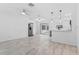 Bright open floor plan featuring tile floors, sliding glass doors, and a modern kitchen at 1113 Leeward Dr, Deltona, FL 32738