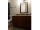 Bathroom vanity featuring granite countertops and cherry cabinetry at 11574 Westwood Blvd # 1122, Orlando, FL 32821