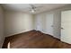 Bright, spacious bedroom with hardwood floors and neutral paint at 11574 Westwood Blvd # 1122, Orlando, FL 32821