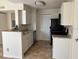 Bright kitchen featuring white cabinets, granite countertops, and modern appliances at 11574 Westwood Blvd # 1122, Orlando, FL 32821