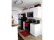 Updated kitchen with stainless steel appliances, modern cabinetry and laminate countertops at 11574 Westwood Blvd # 1122, Orlando, FL 32821