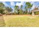 Spacious backyard area showcasing lush greenery and surrounding natural landscape, a serene outdoor space at 12 Pecan Drive Loop, Ocala, FL 34472