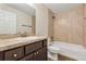 Well-lit bathroom features a shower over the tub and modern vanity with a large mirror at 12 Pecan Drive Loop, Ocala, FL 34472