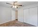 Bedroom features include a ceiling fan, double closet, carpeted floor and a door that leads into another room at 12 Pecan Drive Loop, Ocala, FL 34472