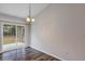 Cozy dining space with sliding glass door and modern chandelier at 12 Pecan Drive Loop, Ocala, FL 34472