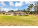 Lovely single-story home with a spacious front yard, inviting curb appeal at 12 Pecan Drive Loop, Ocala, FL 34472