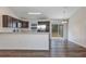 Kitchen with stainless steel appliances, a breakfast bar, and sliding glass doors at 12 Pecan Drive Loop, Ocala, FL 34472