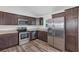 Contemporary kitchen features stainless steel appliances and ample cabinet space at 12 Pecan Drive Loop, Ocala, FL 34472
