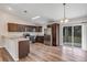 Well-equipped kitchen featuring stainless steel appliances, dark cabinets, and wood flooring at 12 Pecan Drive Loop, Ocala, FL 34472