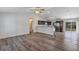 Open-concept living area with hardwood floors seamlessly connects to the modern kitchen at 12 Pecan Drive Loop, Ocala, FL 34472