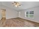 Inviting living area with wood floors, neutral walls, and plenty of natural light at 12 Pecan Drive Loop, Ocala, FL 34472