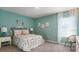 Bedroom with floral bedding and neutral decor at 1294 E Ohio Ave, Deland, FL 32724