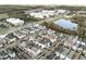 Aerial view of neighborhood with houses near a lake and road at 1413 Resolute St, Celebration, FL 34747