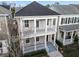 Two-story home with a balcony, gray roof and light beige exterior at 1413 Resolute St, Celebration, FL 34747