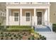 Front entrance with dark door and white columns at 1413 Resolute St, Celebration, FL 34747