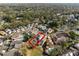 An aerial view of a well-maintained neighborhood surrounded by lush greenery and mature trees at 1416 Creekside Cir, Winter Springs, FL 32708